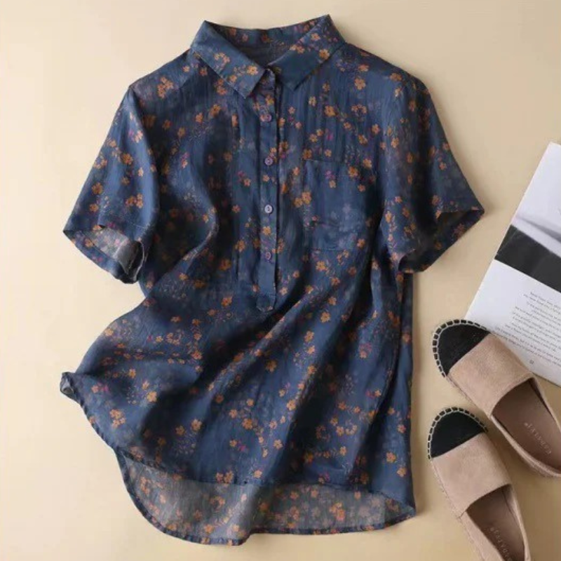 Relaxed fit women's floral blouse, a comfortable and versatile half-placket top with decorative buttons for everyday wear.