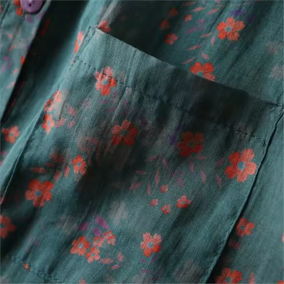 Comfortable women's floral summer top with unique half-placket and functional button details, offering casual elegance.