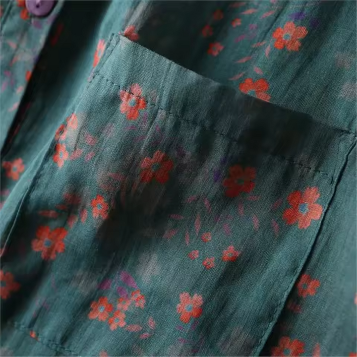 Comfortable women's floral summer top with unique half-placket and functional button details, offering casual elegance.