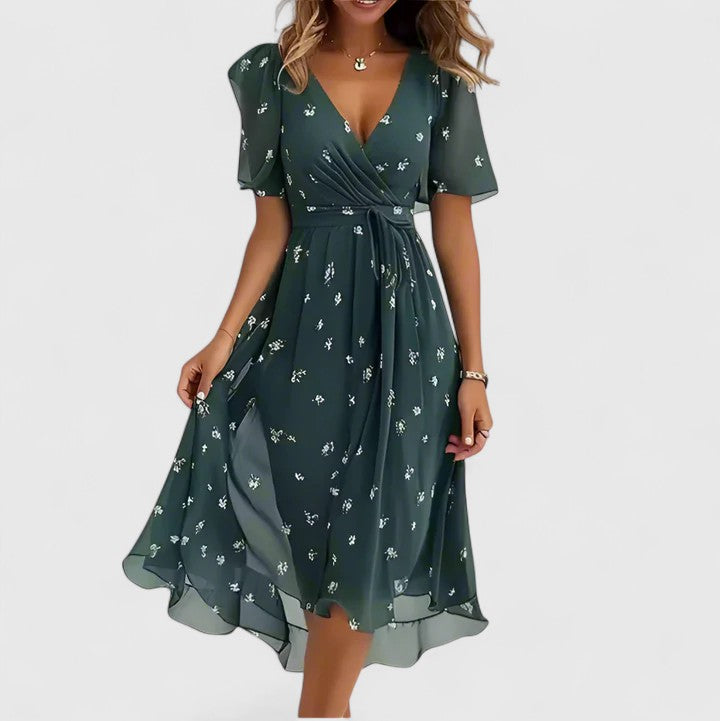 Vibrant floral print midi dress for women, styled with a plunge V-neck and elegant flutter sleeves. Flowy.