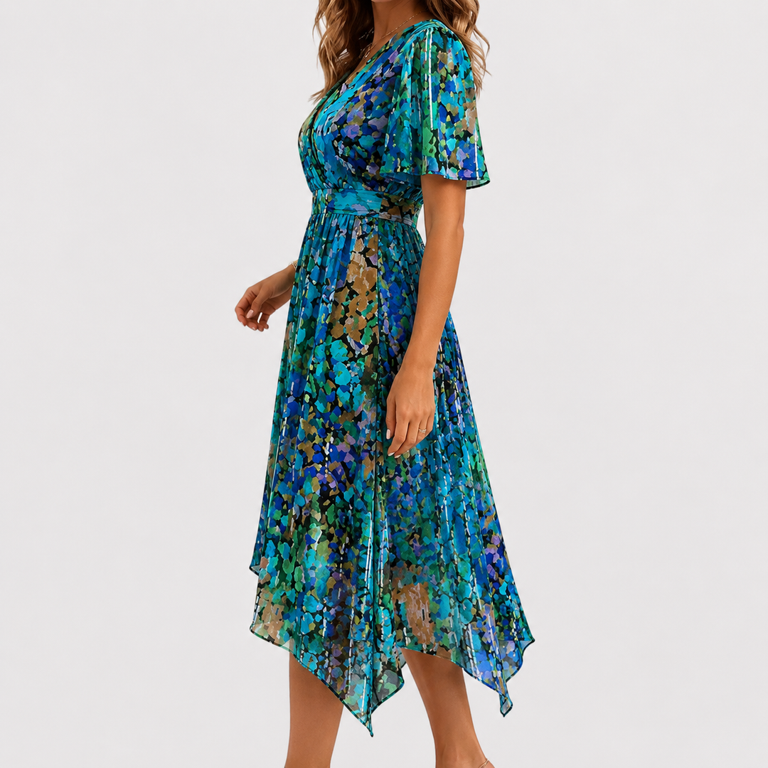Back view of a women's floral midi dress, showcasing the elegant flow and midi length, suitable for parties.