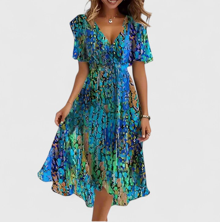 Women's floral midi dress with a high-low hem, plunge V-neck & flutter sleeves. Elegant party wear.