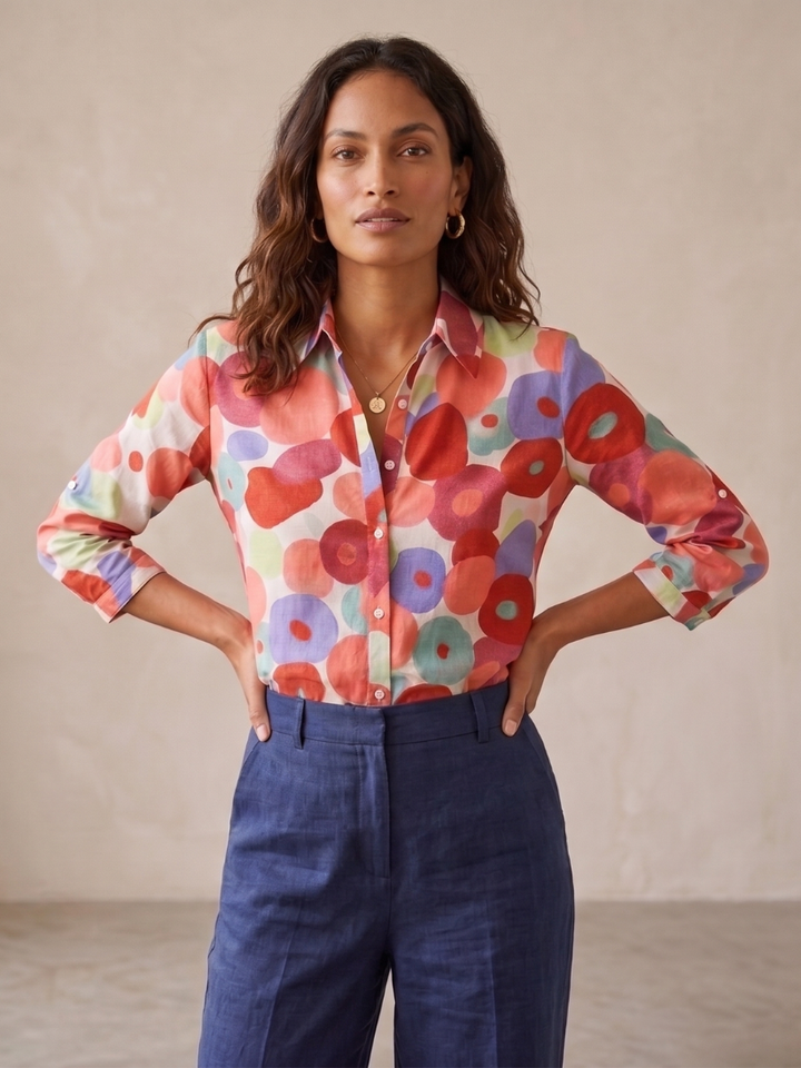 Women's floral print button-down blouse with relaxed roll-tab long sleeves. Versatile for spring & summer casual wear.