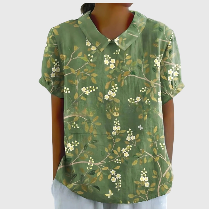 Front view of a white women's floral print collared blouse. Short sleeve summer top for casual or office.