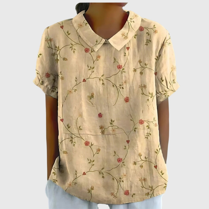 Lightweight women's floral print short sleeve collared blouse. Comfortable and breathable summer top.