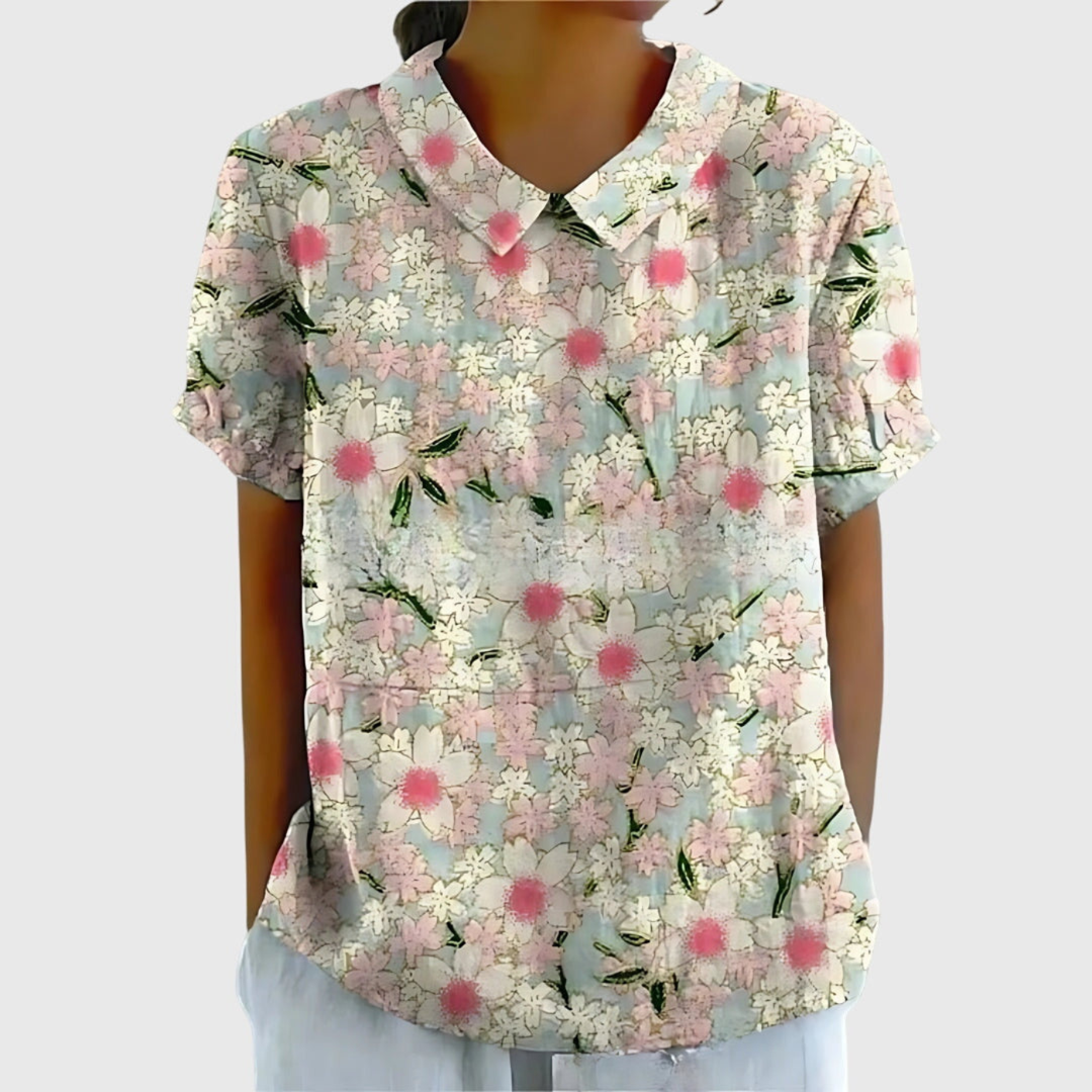 Elegant white women's floral print short sleeve collared blouse. Perfect for summer casual or office attire.