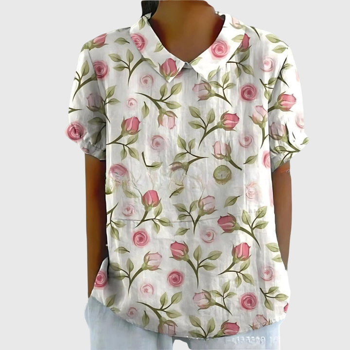 Green floral print women's short sleeve collared blouse. A chic and comfortable top for everyday and office wear.