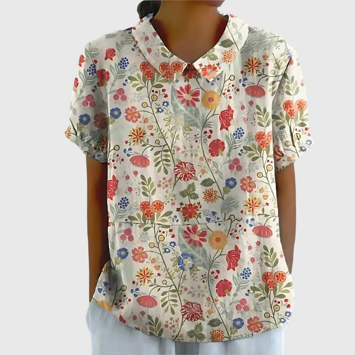 Versatile women's short sleeve floral print blouse with a collar. Great for summer, casual, or office settings.