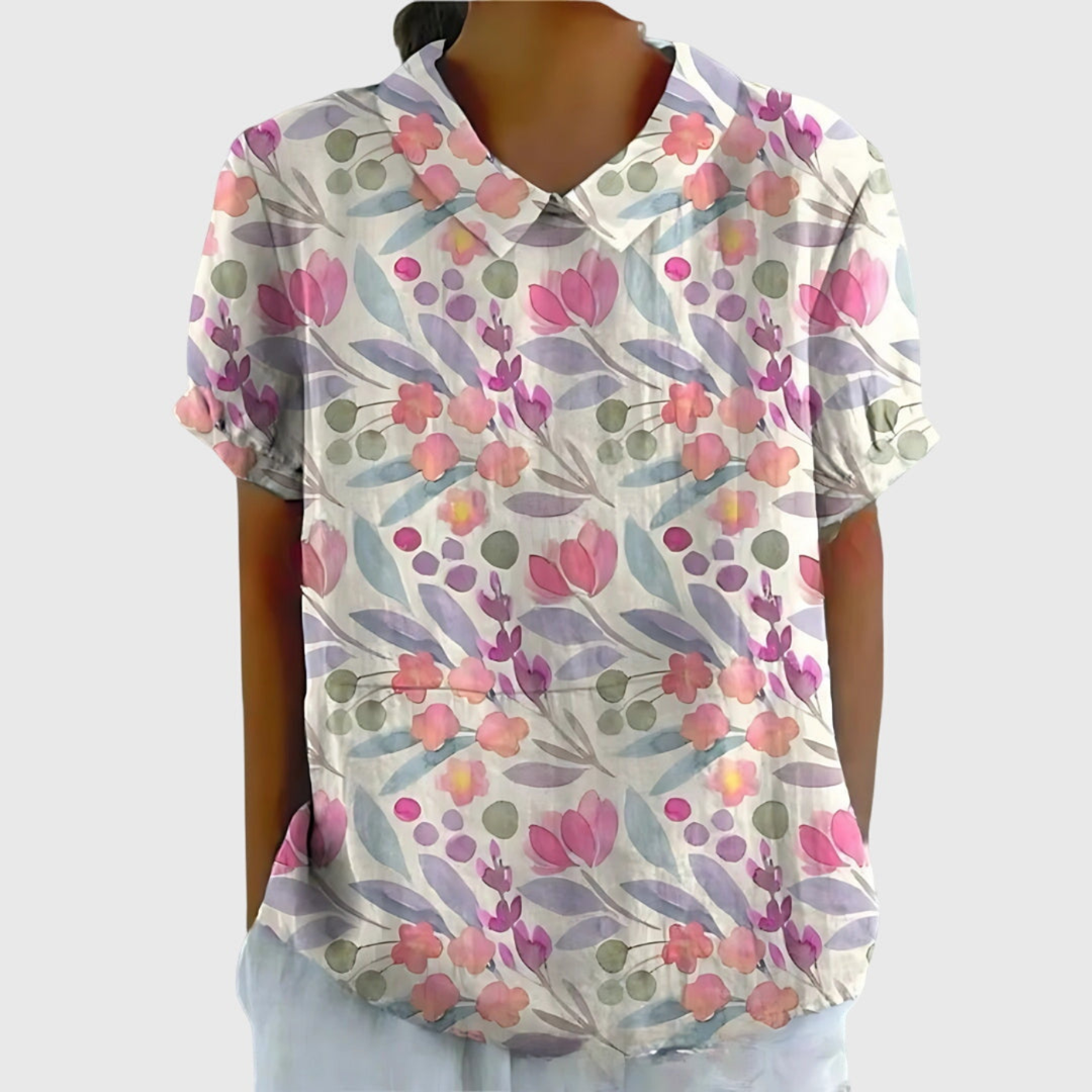 Elegant women's floral print collared blouse. Short sleeve summer top, perfect for a refined casual or office look.