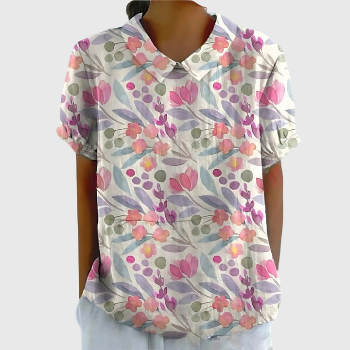 Elegant women's floral print collared blouse. Short sleeve summer top, perfect for a refined casual or office look.