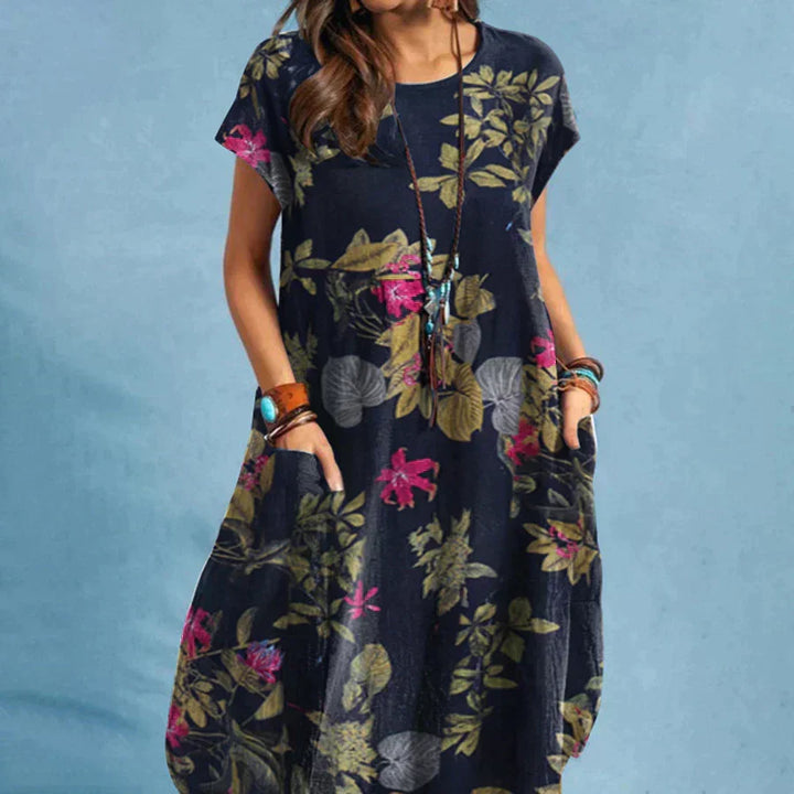 Women's floral print midi dress with practical pockets. Perfect casual summer or vacation wear, short sleeve.