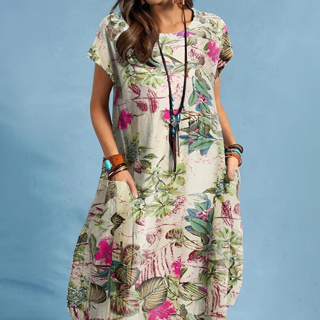 Flowy women's floral midi dress, ideal for summer casual wear or vacation. Features short sleeves & convenient pockets.