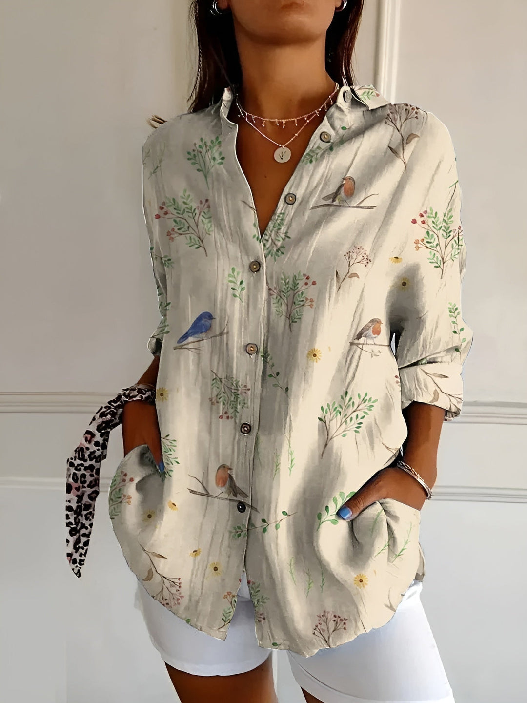 Stylish women's floral print oversized button-down blouse. A relaxed fit, printed top for summer casual wear.