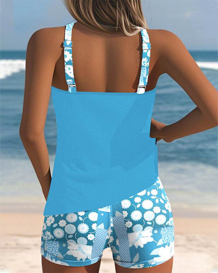 Elegant floral print racerback tankini swimsuit for women. Two-piece set with boyshorts.