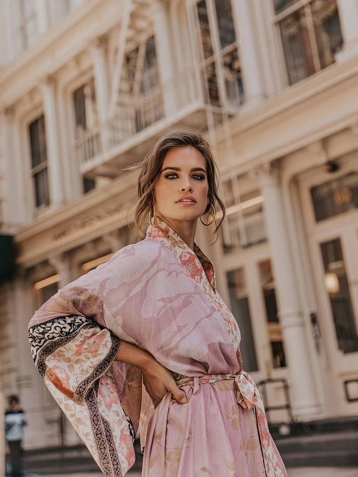 Flowing women's floral print kimono, a lightweight open-front beach coverup & elegant resort wear for vacation.