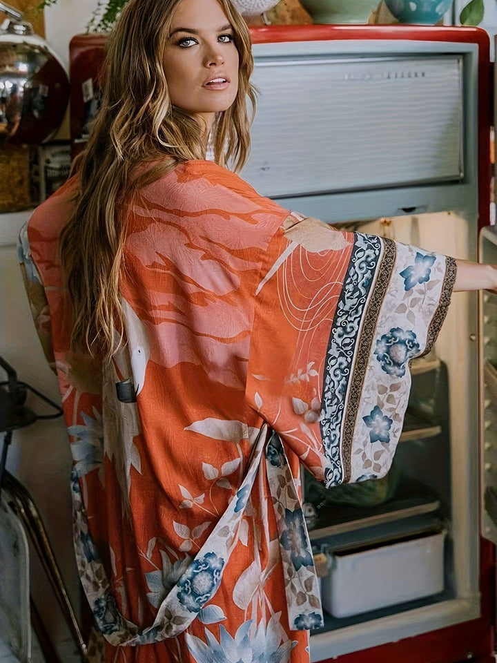 Flowing open-front women's kimono with vibrant floral print, perfect for beachwear & resort style.