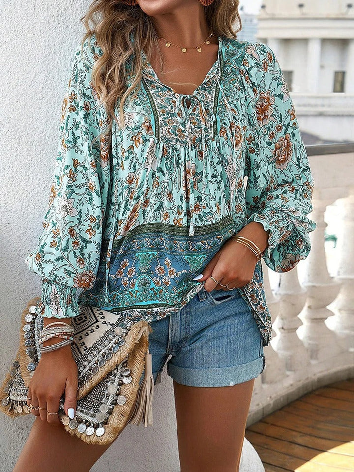 Vibrant floral print women's puff sleeve top, a chic choice for summer outfits.