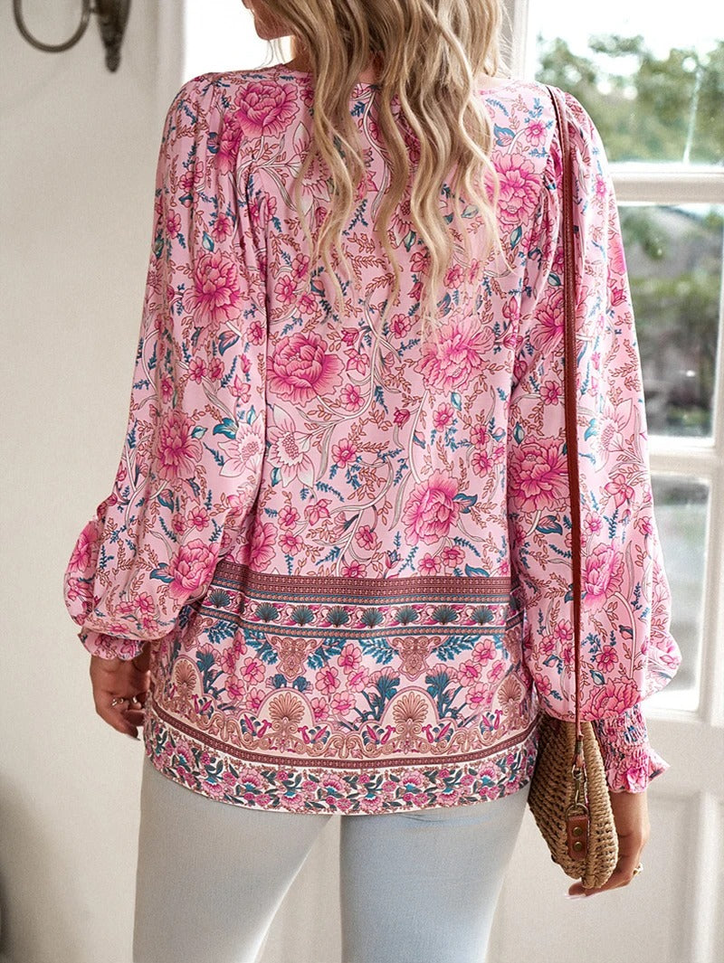 Chic floral puff sleeve summer top for women, versatile & comfortable for daily wear.