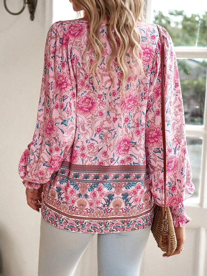 Chic floral puff sleeve summer top for women, versatile & comfortable for daily wear.