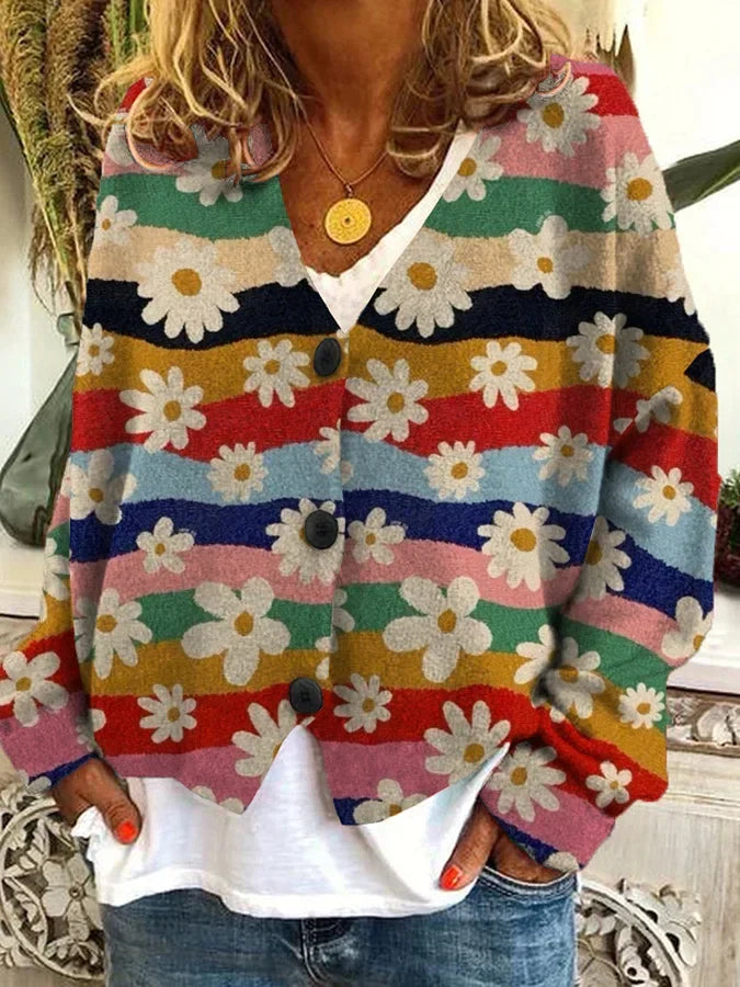 Relaxed fit women's cardigan with vibrant floral stripe print. Button-up closure, perfect for casual fashion.