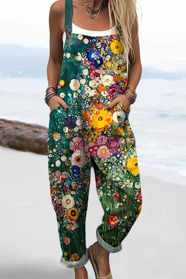 Casual women's floral suspender jumpsuit featuring button detail and strappy back. Ideal for relaxed summer fashion.