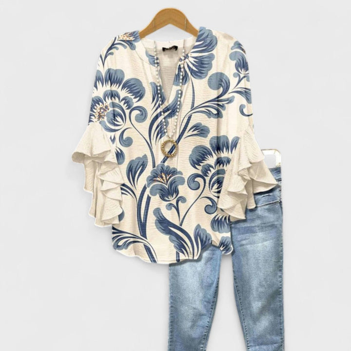 Women's floral V-neck blouse with elegant ruffle sleeves, perfect for spring casual chic or office wear.