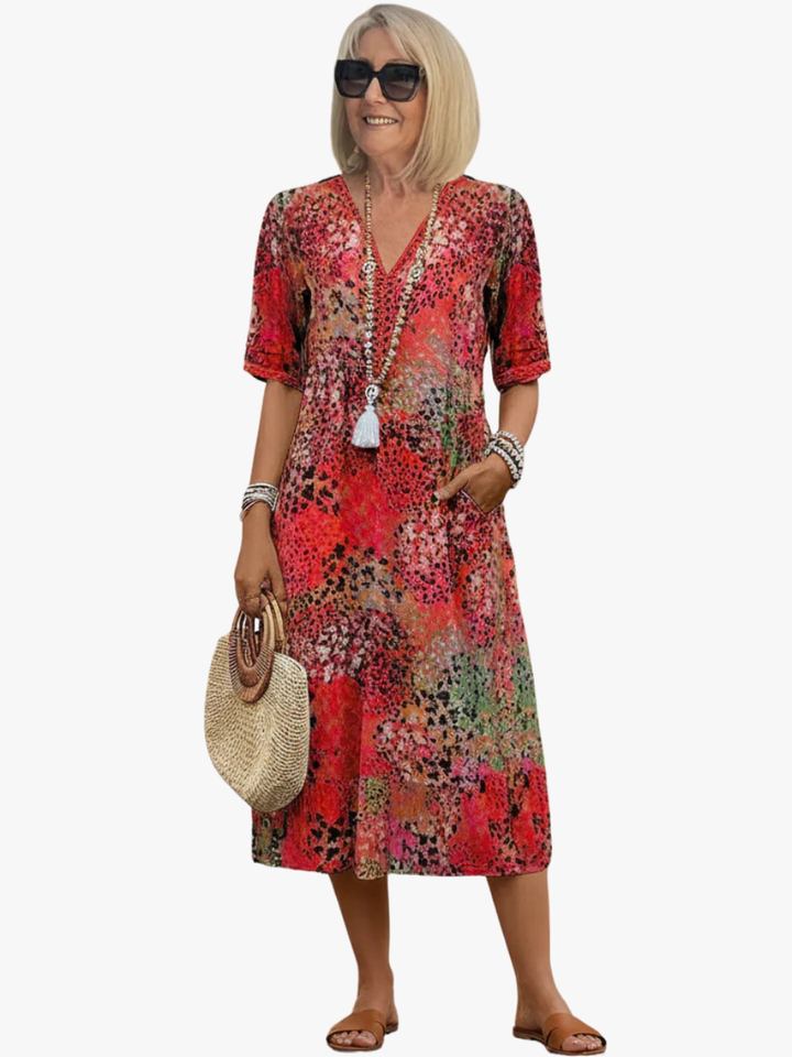 Women's floral V-neck midi dress with an A-line silhouette, perfect for comfortable everyday summer wear.