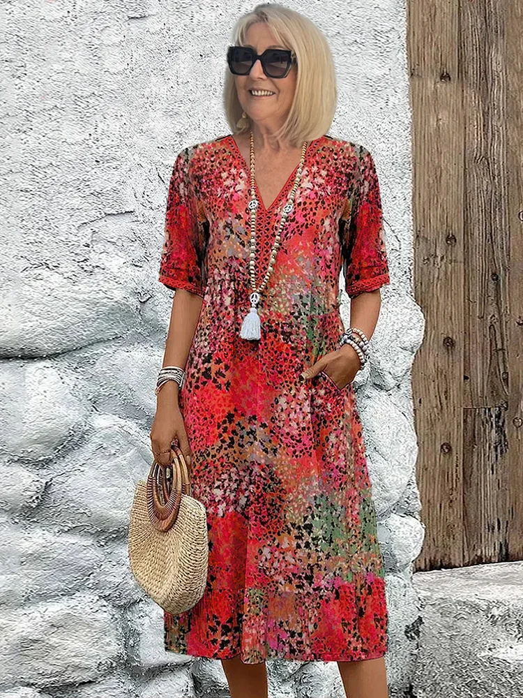 Stylish women's printed floral midi dress, featuring a flattering V-neck and a relaxed A-line fit.