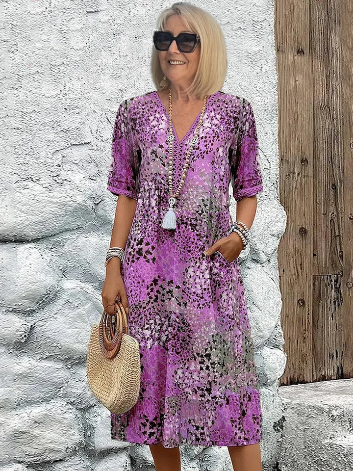 Lightweight women's summer floral V-neck midi dress, offering comfort and a flowy A-line design.