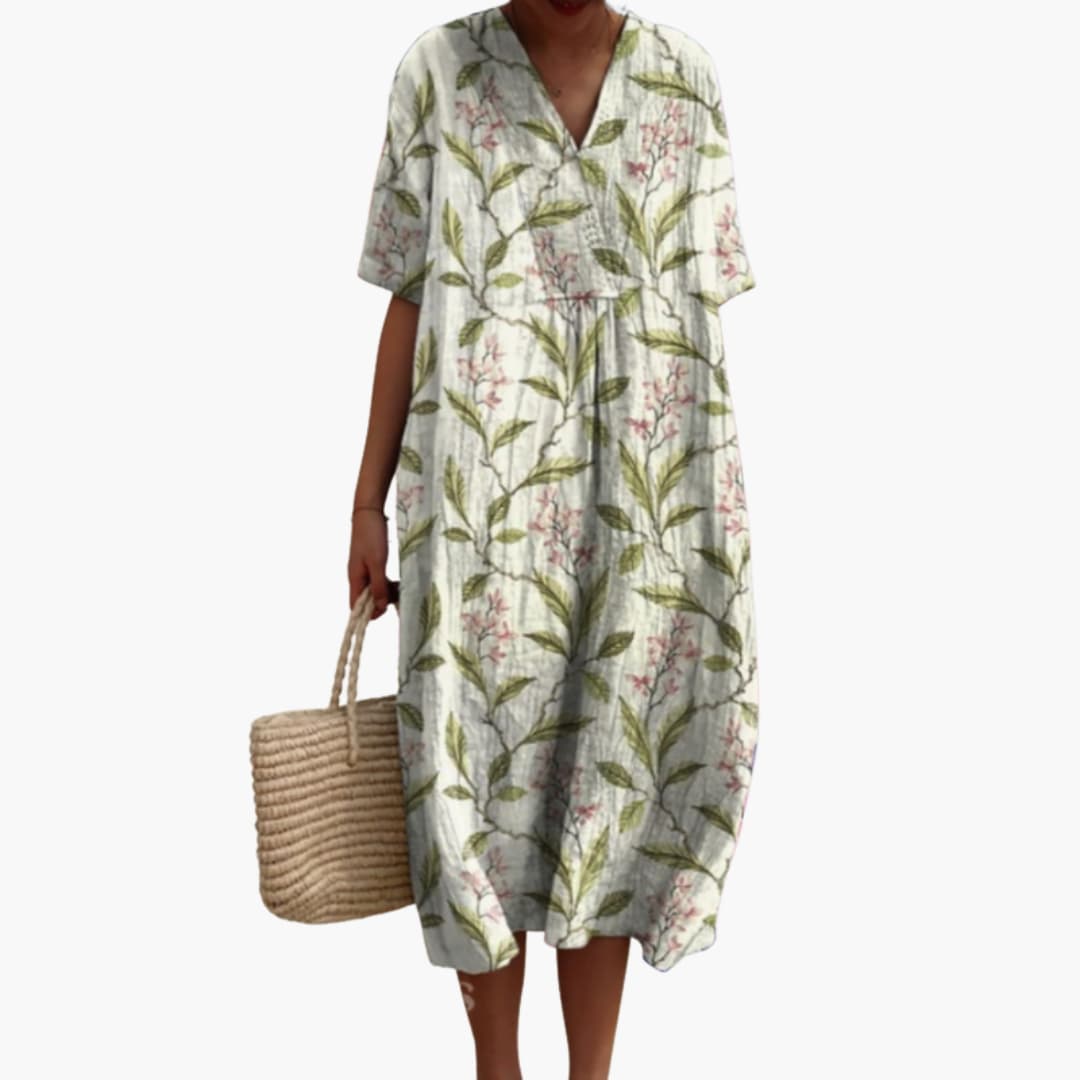 Effortlessly chic women's floral midi dress, V-neck, short sleeves, oversized for ultimate summer comfort.