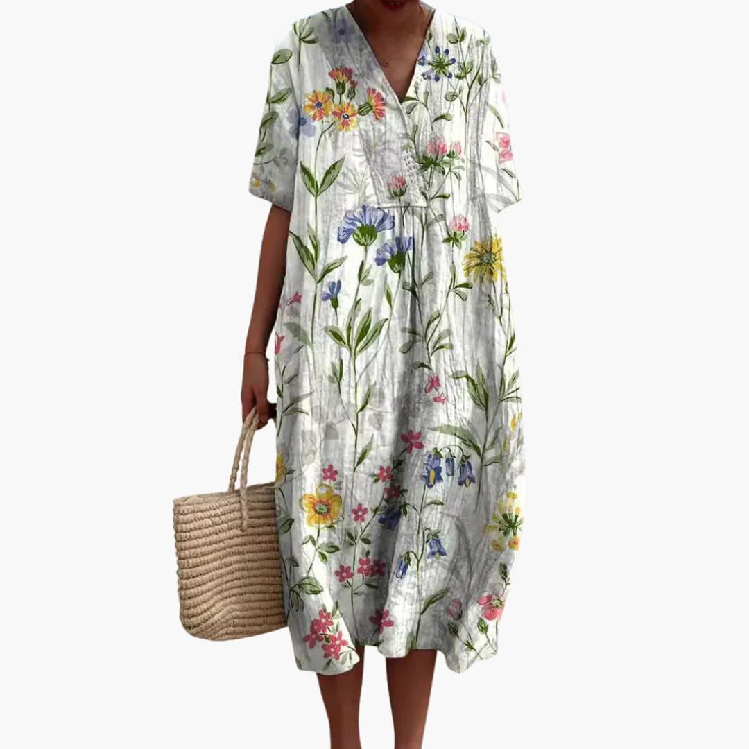 Elegant floral print oversized midi dress for women, designed with a V-neck and convenient pockets.