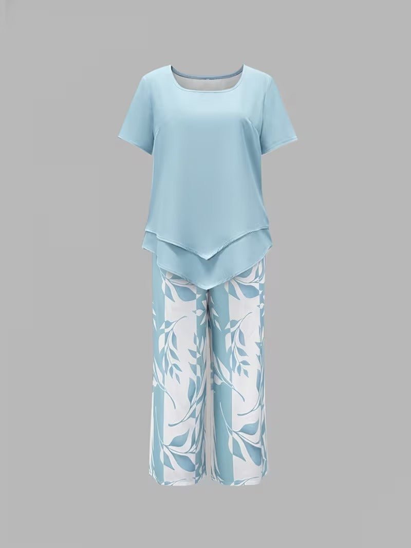 Relaxed fit women's floral wide leg two-piece set. Summer-ready V-neck top & flowy pants.