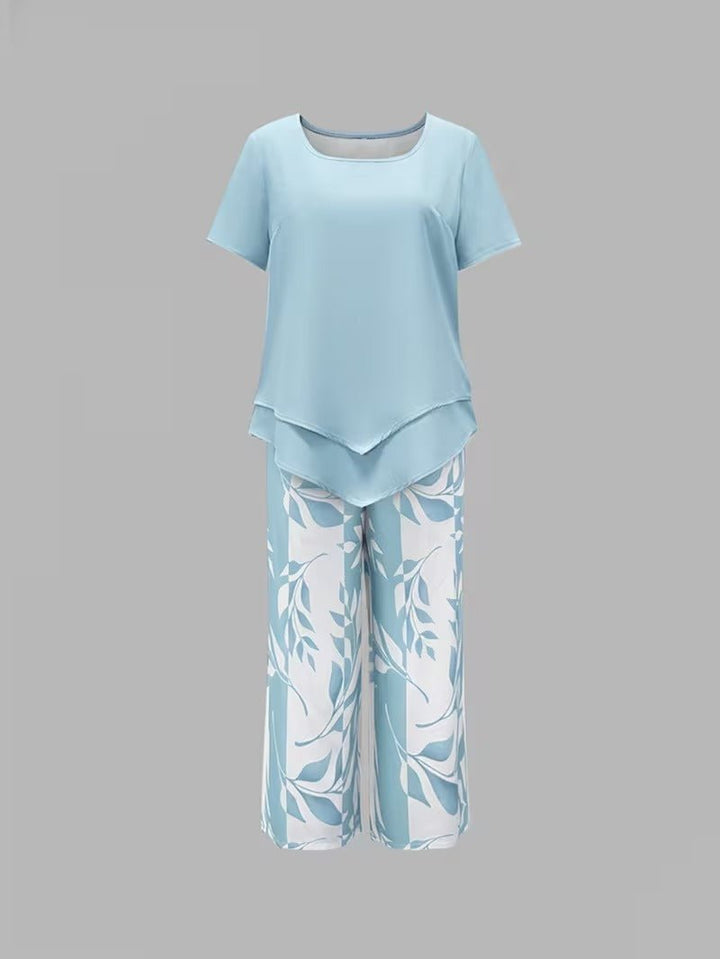 Relaxed fit women's floral wide leg two-piece set. Summer-ready V-neck top & flowy pants.