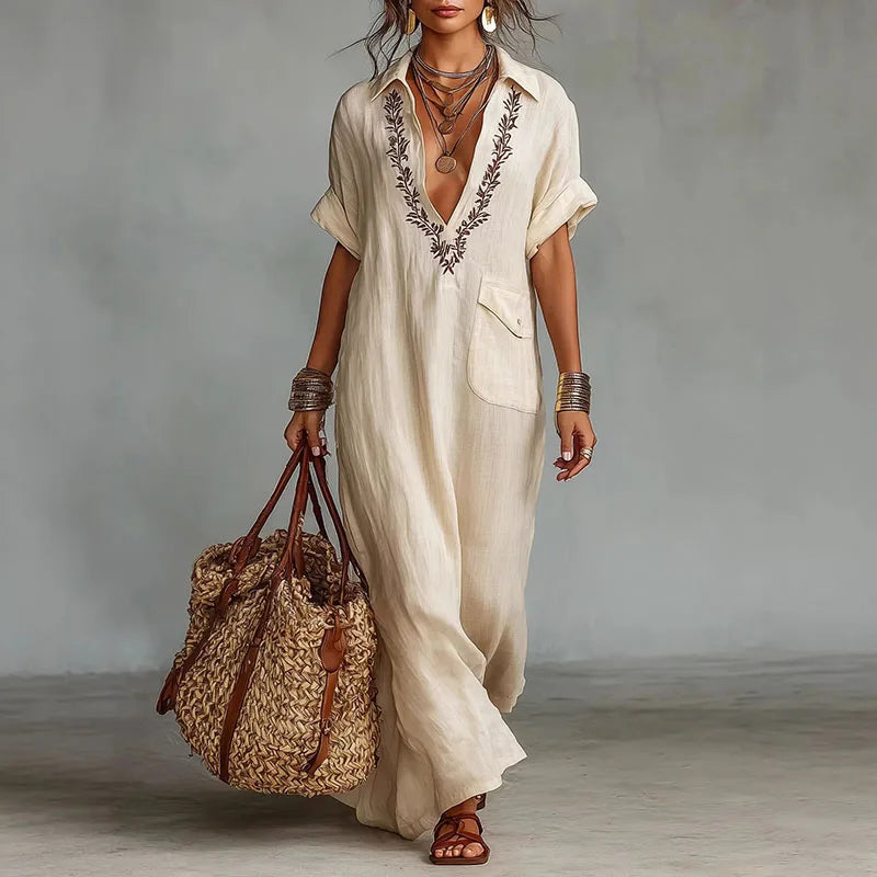 Women's flowing bohemian maxi dress with flattering V-neck, perfect for summer vacations or beach days.