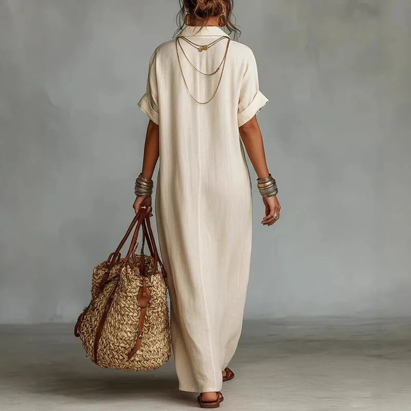 Elegant women's printed bohemian V-neck maxi dress, featuring a flowy silhouette & short sleeves.