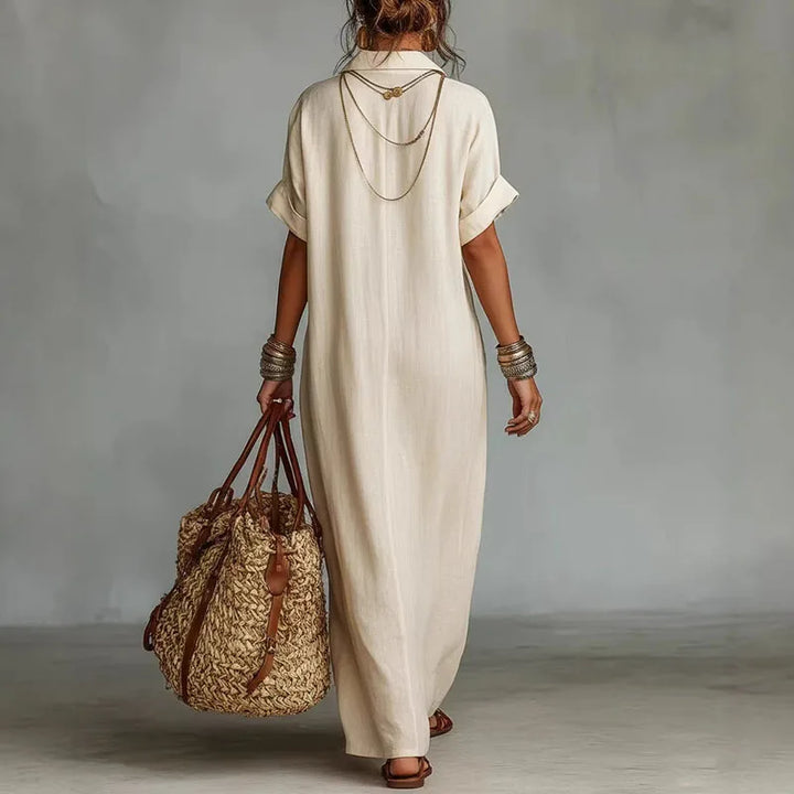 Elegant women's printed bohemian V-neck maxi dress, featuring a flowy silhouette & short sleeves.
