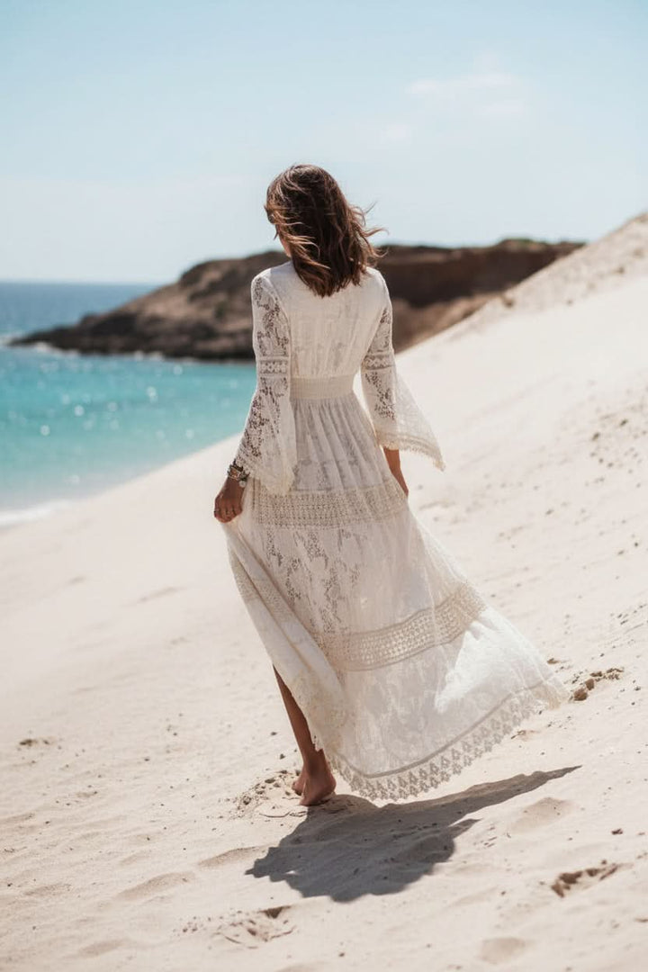 Chic women's boho V-neck maxi dress in white, offering effortless style for summer fashion and vacation outfits.