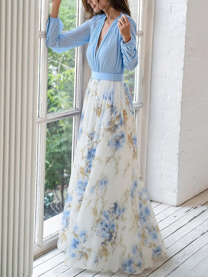 Elegant women's floral print maxi dress featuring a V-neck and flowing design, ideal for casual summer wear.