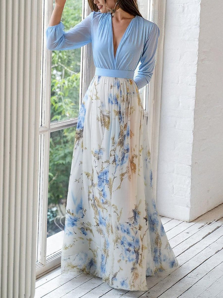 Stylish women's summer V-neck maxi dress with a vibrant floral pattern and flowing, comfortable fit.