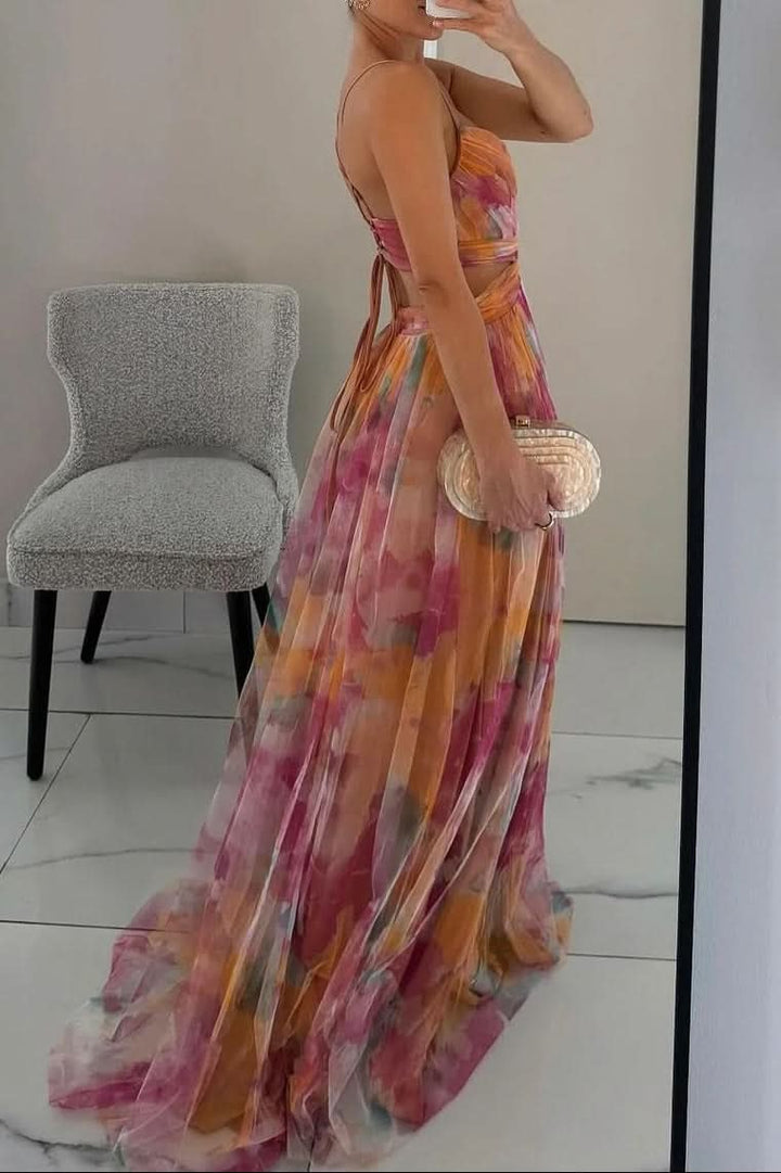 Woman models a flowing sleeveless maxi dress, showcasing its elegant drape & effortless summer style.