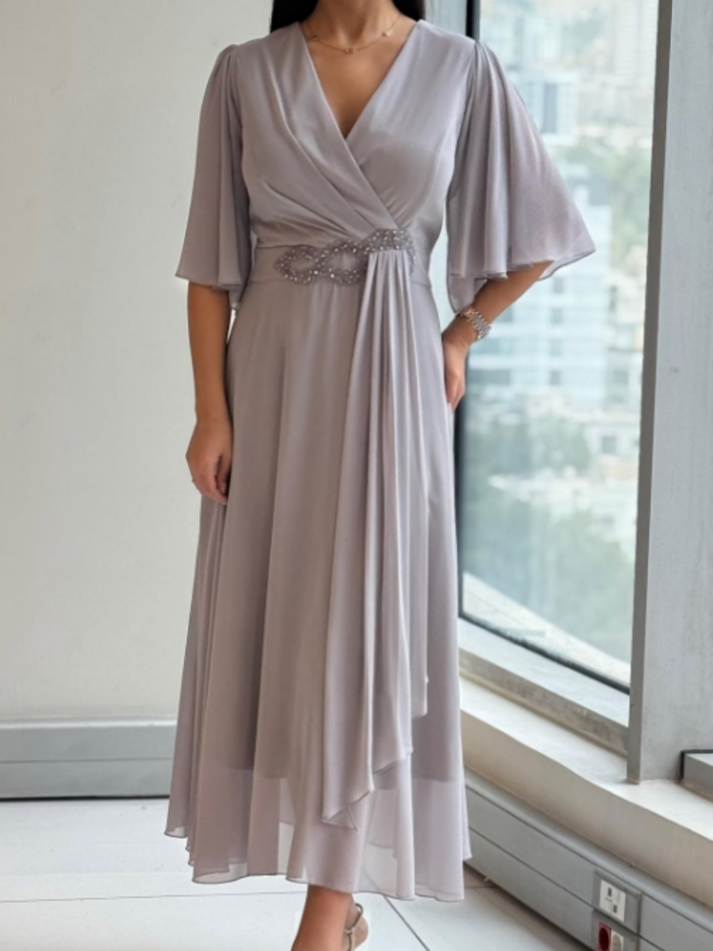 Women's flowing V-neck maxi dress with adjustable straps, perfect for summer casual or elegant resort wear.
