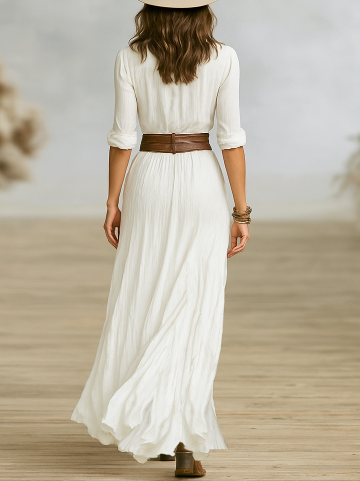 Stylish women's flowy boho maxi dress for spring/summer, with a cinched belt & an elegant front split.
