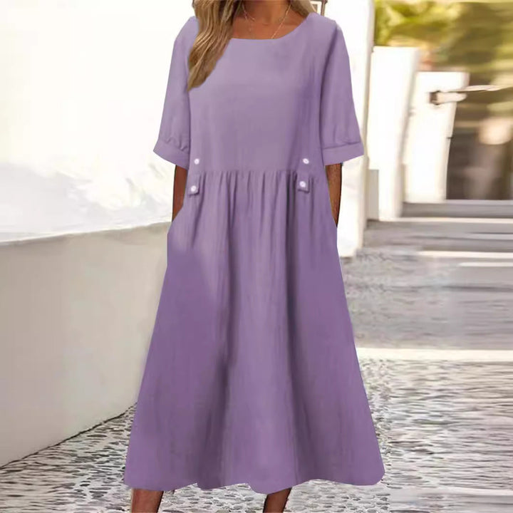 Women's flowy chic midi dress, perfect for summer comfort. Relaxed fit sleeveless design for casual elegance.
