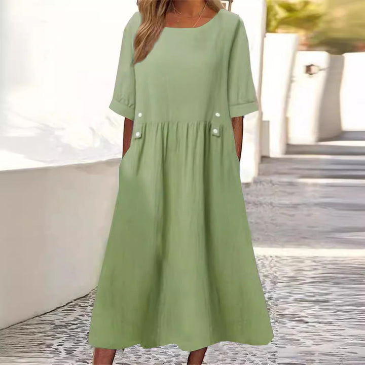 Comfortable women's flowy summer dress; a versatile midi with a relaxed fit for everyday casual elegance.