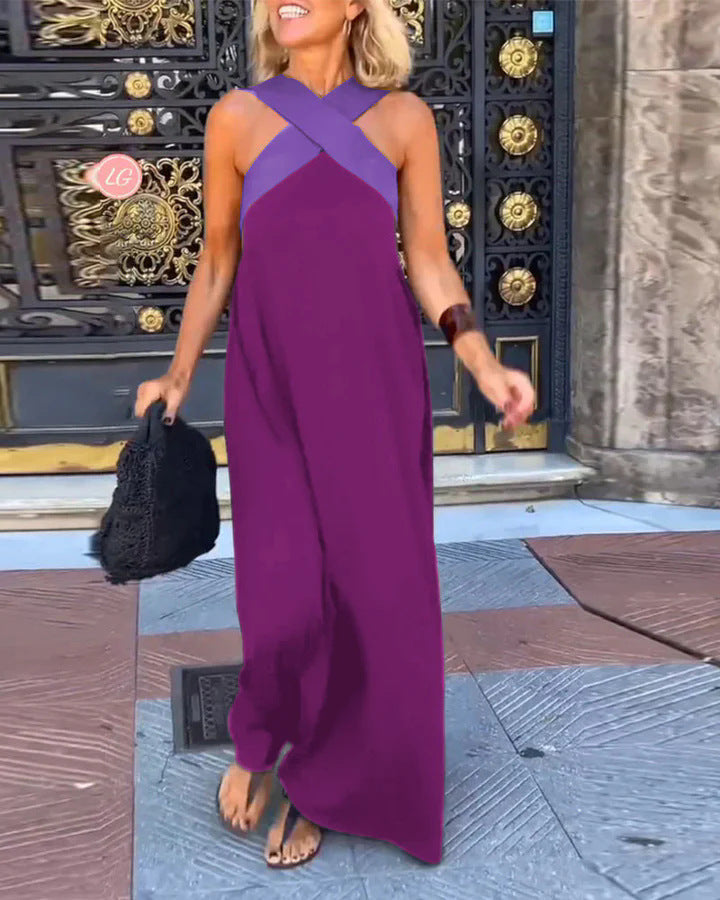 Close-up: stylish cross neck detail on a women's flowy long maxi dress.