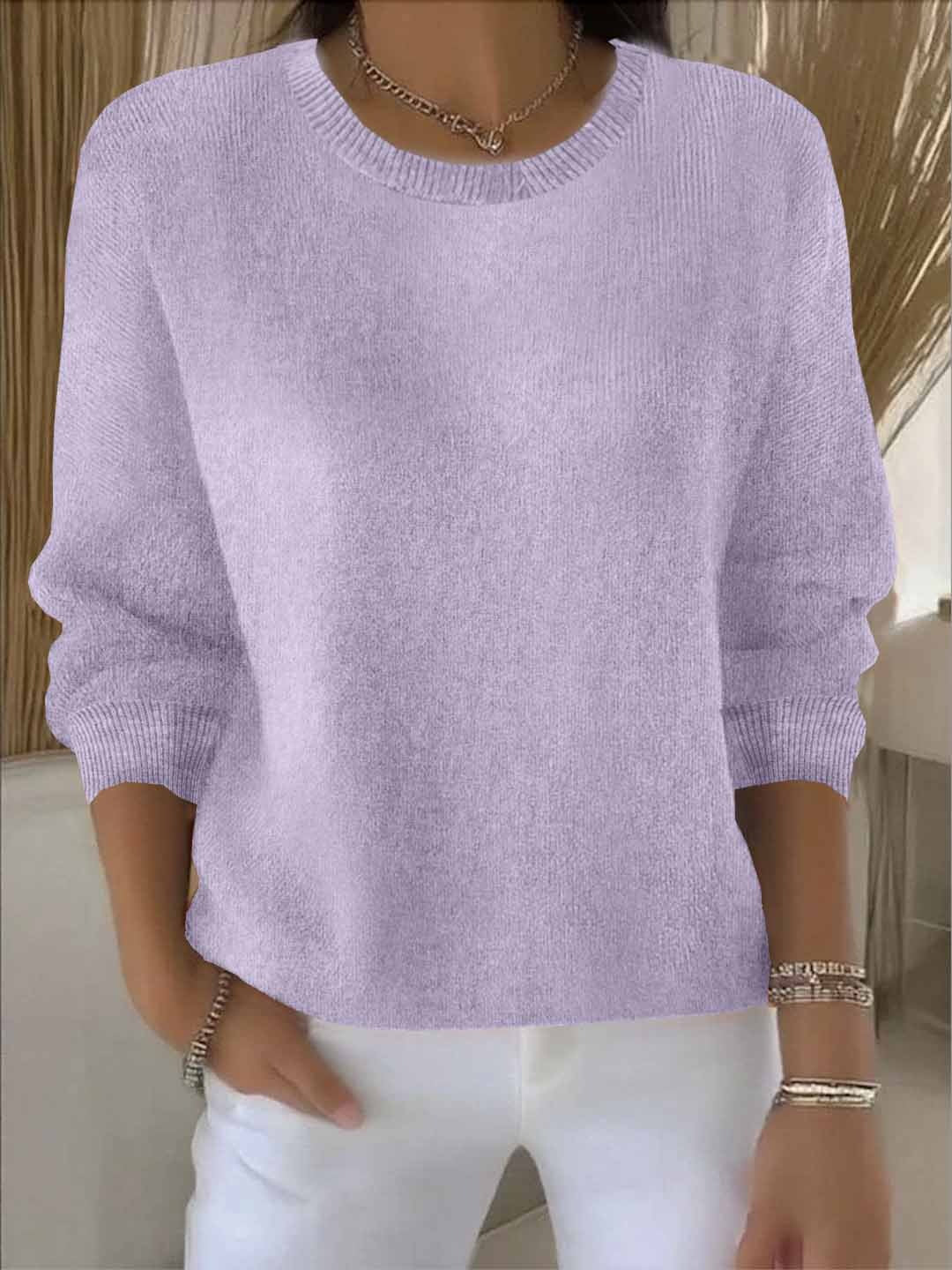 Women's flowy fit sweater in a relaxed pullover style, offering chic comfort for versatile wear.