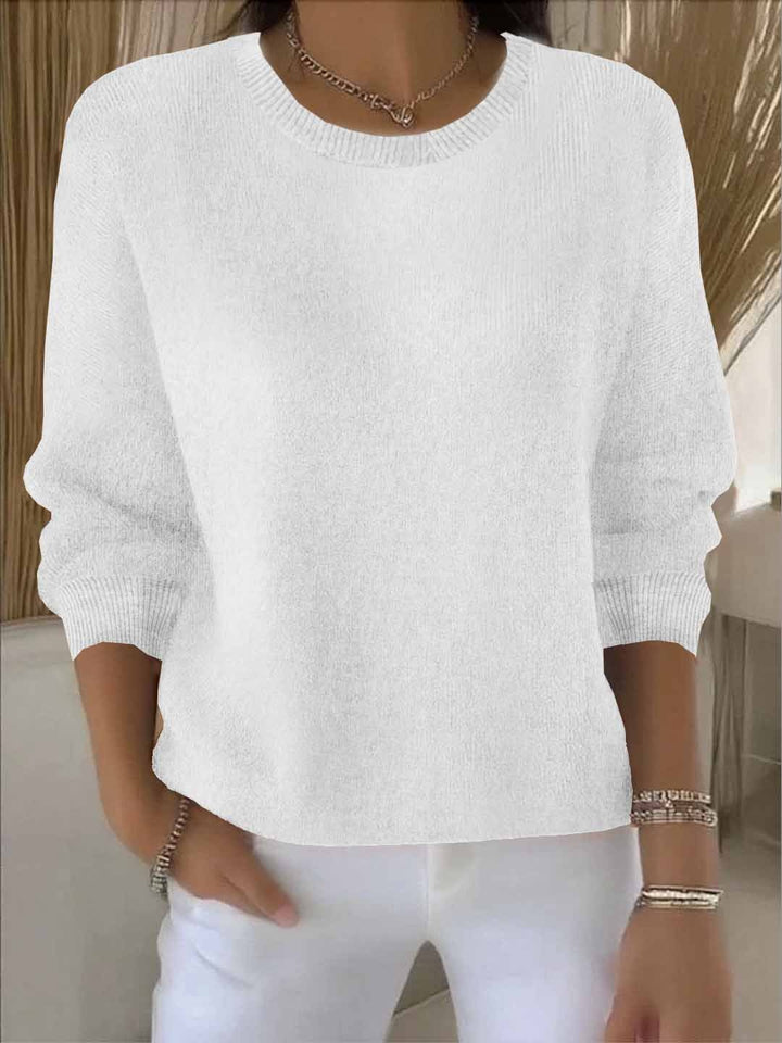 Relaxed fit women's long sleeve sweater, effortlessly chic and flowy. Perfect for everyday layering.