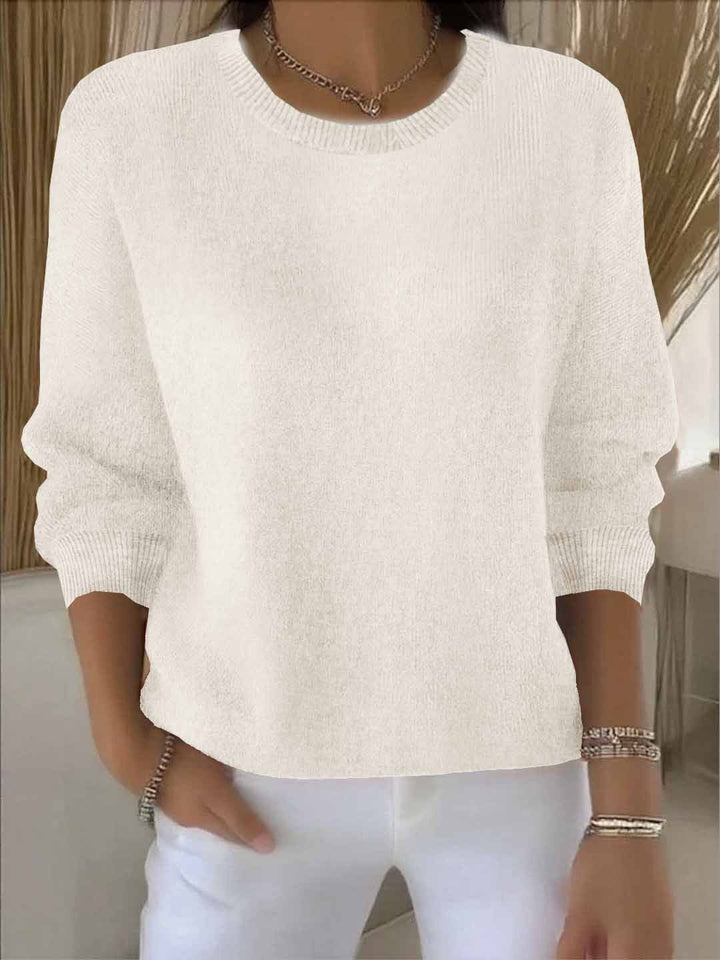 Versatile women's casual sweater, great for everyday layering in cool weather. Chic flowy pullover.