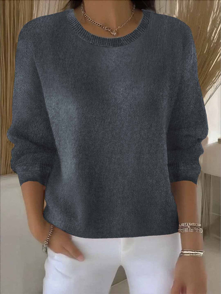 Chic women's flowy pullover sweater, comfortable and versatile for everyday wear. Relaxed long sleeve.
