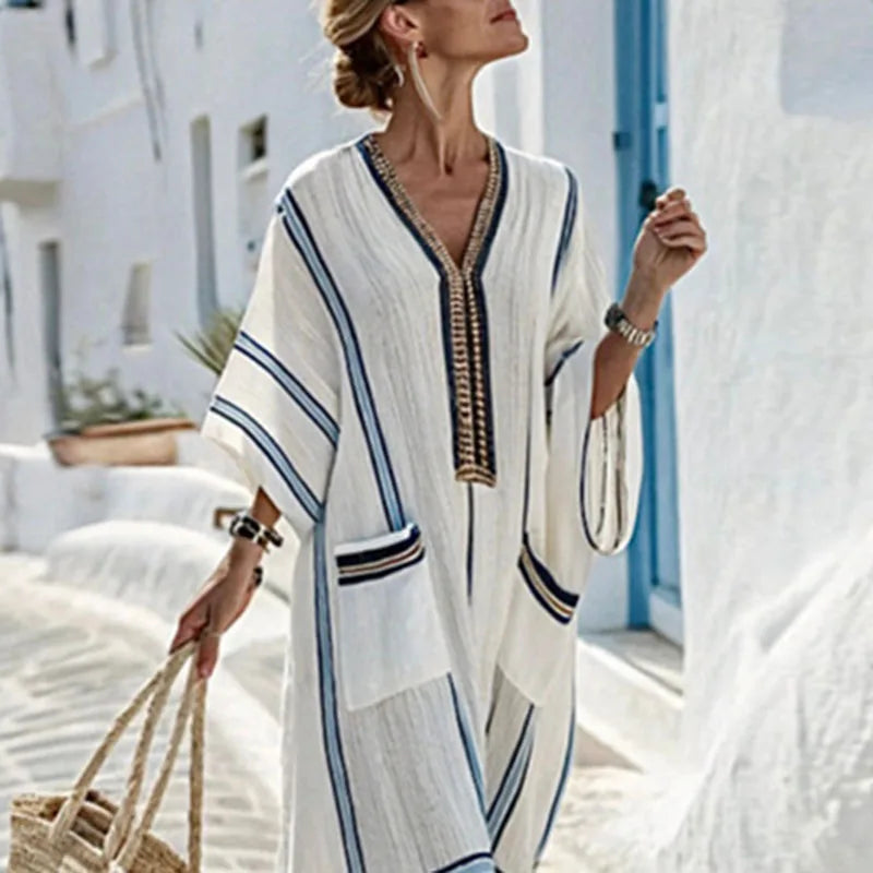 Boho summer flowy maxi dress for women, featuring a relaxed kimono style, V-neck, and practical side pockets.